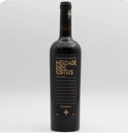 Garrafa de vinho tinto Reserva Herdade dos Coteis com rótulo preto e texto dourado