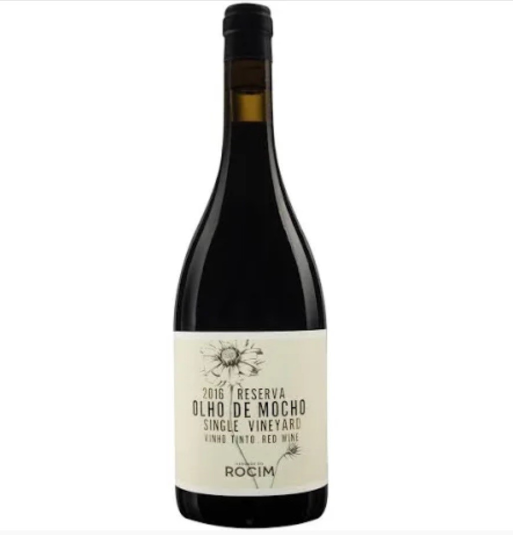 Garrafa de vinho tinto Olho de Mocho com rótulo branco e desenho de flor