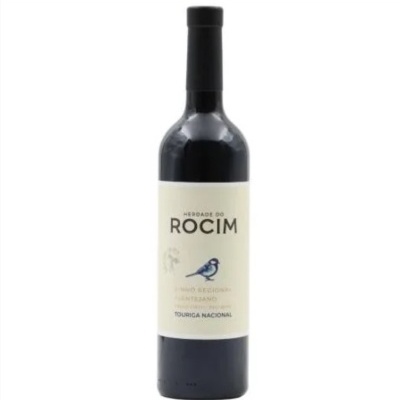 Garrafa de vinho tinto com rótulo creme e pássaro azul