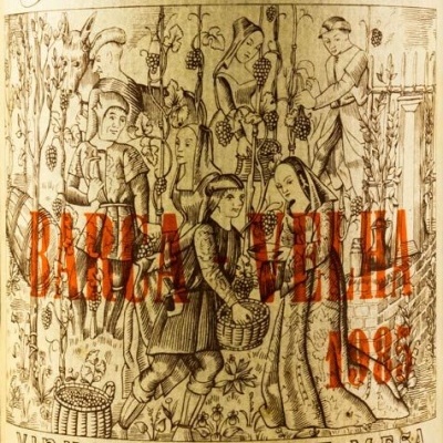 Etiqueta de vinho Ferreirinha Barca Velha 1983 com ilustração de vindima e texto em castanho e vermelho