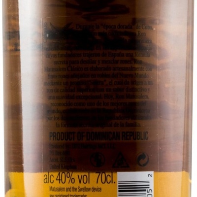 Rótulo amarelo na parte traseira de garrafa com texto sobre teor alcoólico e consumo responsável