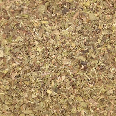 Mistura de ervas secas em tons verdes e castanhos com textura irregular.