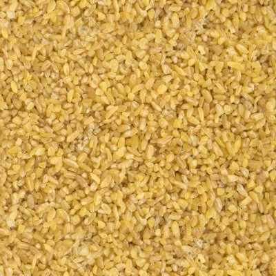 Grão de cuscuz amarelo com textura granular