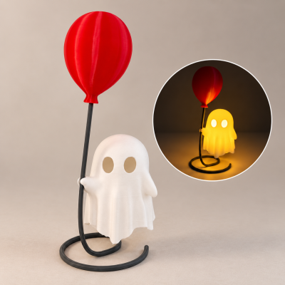 Candeeiro de fantasma com balão vermelho e base preta em fundo neutro