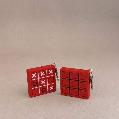 Porta-chaves em silicone vermelho com design de jogo da velha.