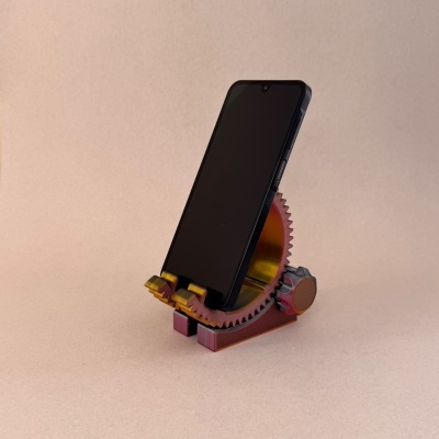 Suporte para telemóvel em metal com design de engrenagem e telemóvel preto