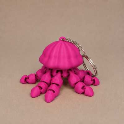 Chaveiro de água-viva cor-de-rosa com tentáculos articulados