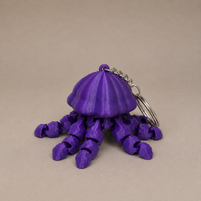 Porta-chaves em forma de polvo roxo com tentáculos articulados