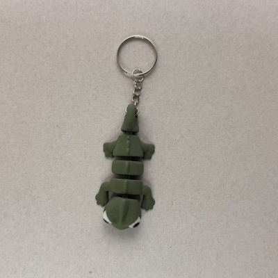 Chaveiro lagarto verde com anel metálico