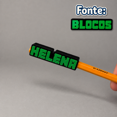 Lápis amarelo com blocos pretos e letras verdes formando HELENA e texto Fonte: BLOCOS no canto superior direito.