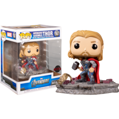 Figura Funko Pop de Thor com capa vermelha e base de pedra junto da caixa