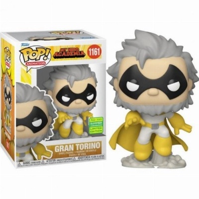 Figura Funko Pop! Gran Torino com máscara preta, capa amarela e traje branco e amarelo ao lado da caixa.