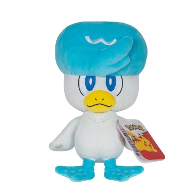 Pelúcia de personagem Pokémon azul e branco com etiqueta