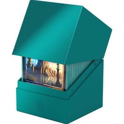 Caixa verde-azulada de cartas de jogo com tampa aberta mostrando cartas decorativas