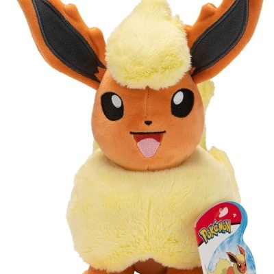Pelúcia do Pokémon Flareon castanho e amarelo com etiqueta POKÉMON