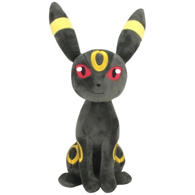 Pelúcia preta e amarela do personagem Umbreon sentada