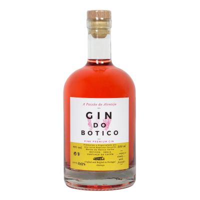 Garrafa de gin rosé com rótulo branco e amarelo e tampa de cortiça