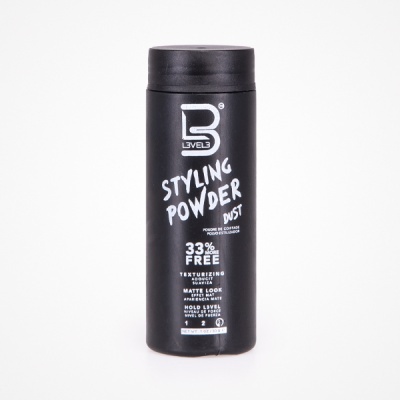 Embalagem preta cilíndrica de styling powder LEVEL3 com texto branco