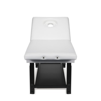 Cama de massagem branca acolchoada com orifício facial e estrutura preta