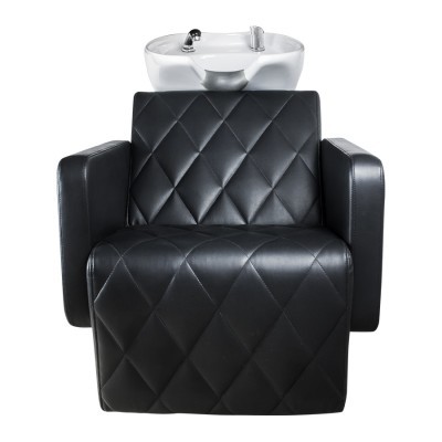 Cadeira preta estofada com lavatório branco em cima