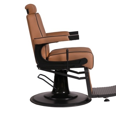 Cadeira de barbeiro bege com base preta e apoio de pés