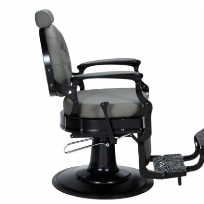 cadeira de barbeiro cinza com estrutura preta e apoio para pés