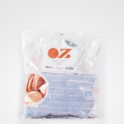 Pacote transparente com cápsulas cor rosa e rótulo com texto OZ ROSA TITANIS