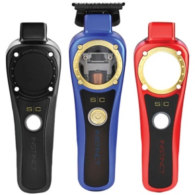 Três máquinas de cortar cabelo INSTINCT nas cores preta, azul e vermelha lado a lado