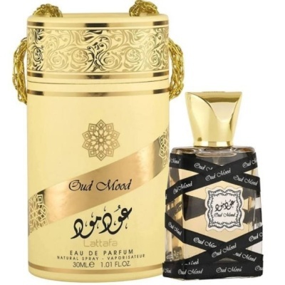 Frasco de perfume Oud Mood com embalagem dourada e preta decorativa