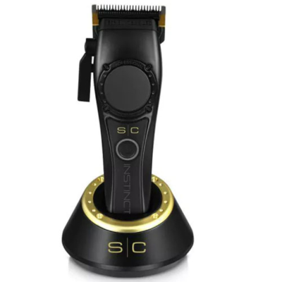 Máquina de cortar cabelo elétrica preta com detalhes dourados numa base de carregamento preta e dourada