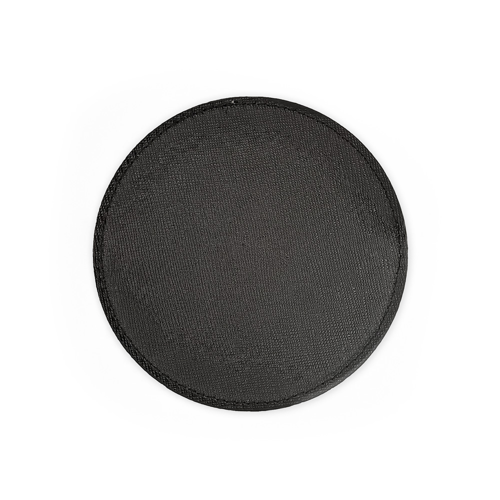 Tampo circular preto texturizado com costura à volta