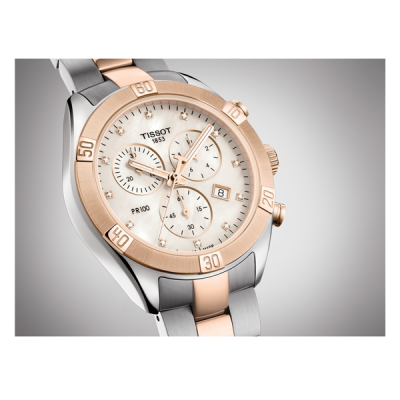 Relógio Tissot PR 100 aço prateado com detalhes dourados e rosados e mostrador branco
