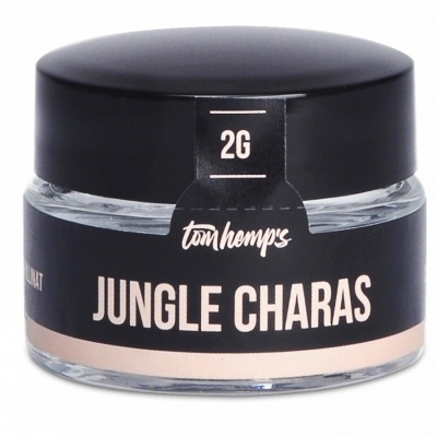 Frasco pequeno de vidro com tampa preta e rótulo preto de produto Jungle Charas
