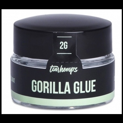 Frasco de vidro com tampa preta e rótulo preto com texto Gorilla Glue