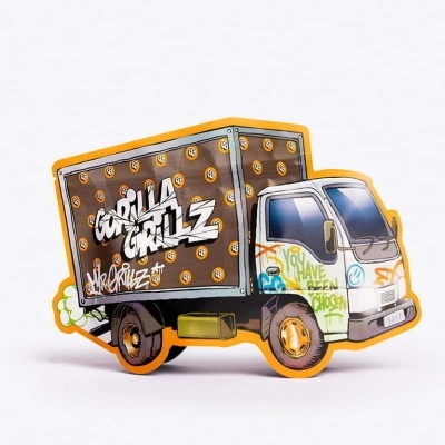 Figura decorativa em forma de carrinha com grafitis coloridos