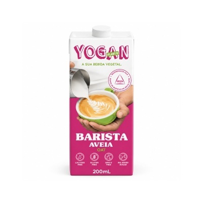 Embalagem branca e rosa de bebida vegetal YOGAN Aveia Barista 200mL com chávena verde e espuma de leite