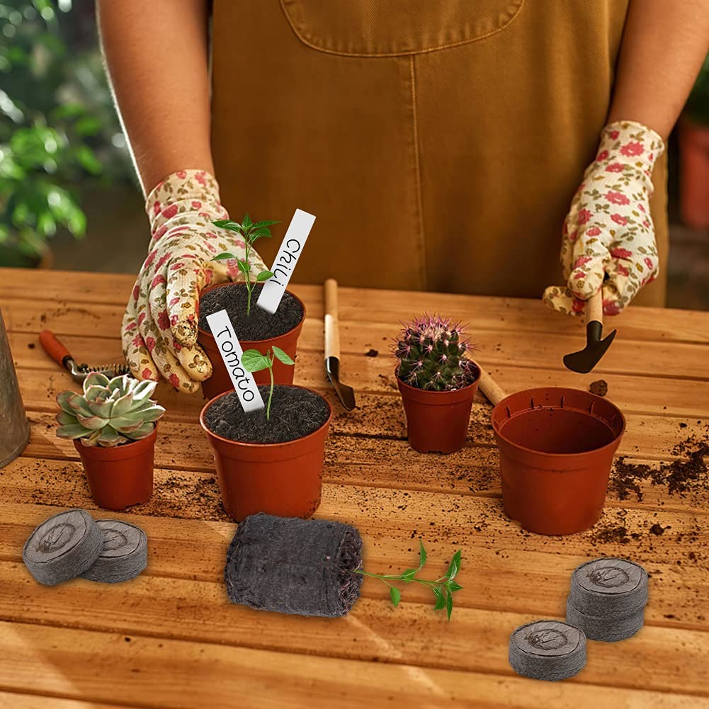 100 piezas de fibra de coco Mãos a plantar tomate com luvas floral em vaso castanho numa mesa de madeira