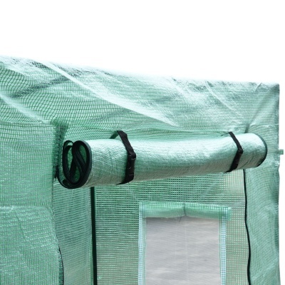 Tenda de estufa verde translúcida com janela e porta enrolada