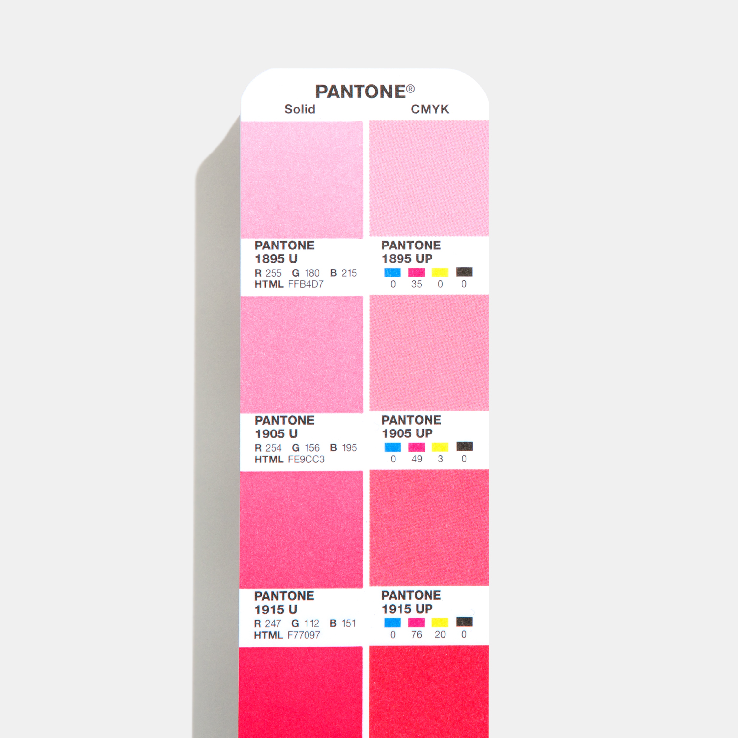 Cartão de amostras Pantone com várias tonalidades de rosa e códigos de cores