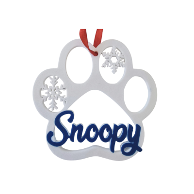 Enfeite de Natal em forma de pata branca com flocos de neve e texto Snoopy