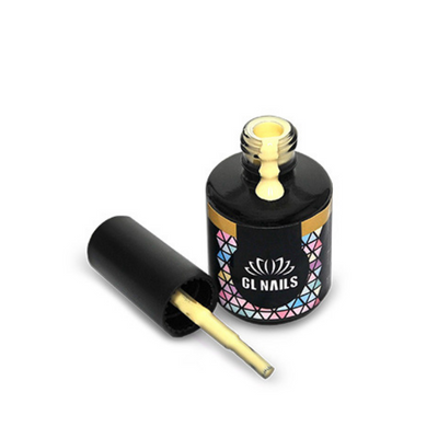 Frasco preto de verniz para unhas aberto com pincel e verniz amarelo