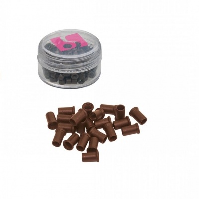 Frasco transparente com peças cilíndricas castanhas dispersas em fundo branco