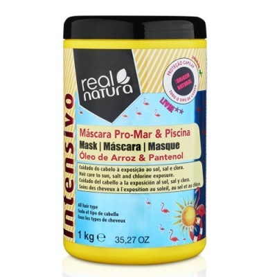 Frasco amarelo com tampa preta de máscara capilar Real Natura com rótulo azul claro e flamingos