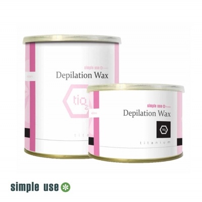 Duas latas de cera depilatória branco, rosa e preto