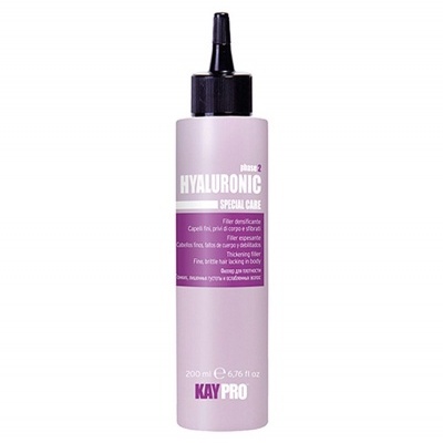 Frasco rosa claro de tratamento capilar Kay Pro com tampa preta e texto branco e rosa