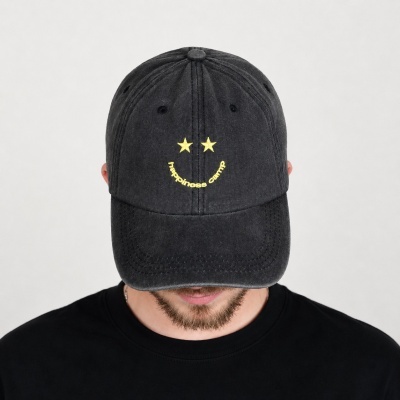 Black baseball cap with yellow stars and happiness camp text