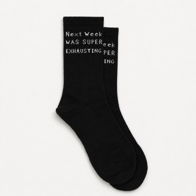 Black socks with white text on a white background