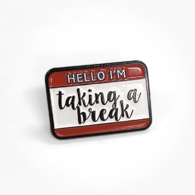 Rectangular enamel pin with HELLO IM taking a break text