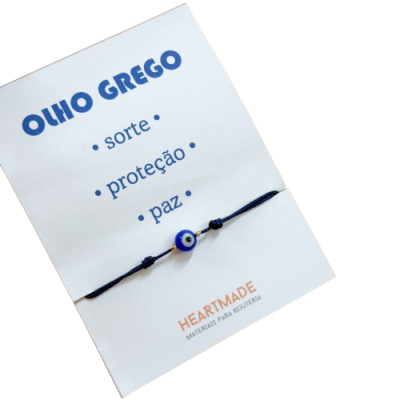 Pulseira azul com conta Olho Grego em cartão branco com texto