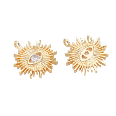 Pendentes dourados em forma de olho com cristal no centro sobre fundo branco